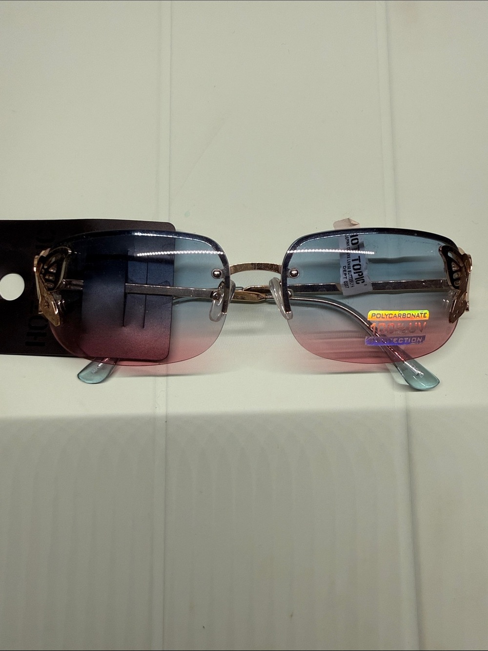 Hot Topic Gradient Blue-to-Pink Rimless Sunglasses with Gold Accents